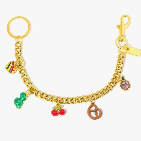 Purse bag charm in gold links with cherry pretzel flower Dino clips on bag - Picture 1 of 3